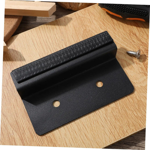 Modern Kitchen Cabinet Foot Pull Handle With Hidden Door Handle For Trash Drawer in black carbon steel, front view on wood surface.