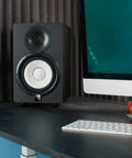 Home studio setup with speaker using 1.8 Inch Isolation Feet For 6 To 8 Inch Speakers, 8 Pack With Adhesive Hemisphere Bumpers.