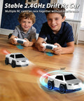 Two kids playing indoors with Cyber Inspired Remote Control Car With 360 Drift Spray Lights And Sound Effects, Rad Two Point Four GHz RC Truck.