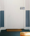 Heavy Duty Stainless Steel Front Door Safety Lock Set Featuring A Beefy Crescent Deadbolt For Foolproof Installation on white door.