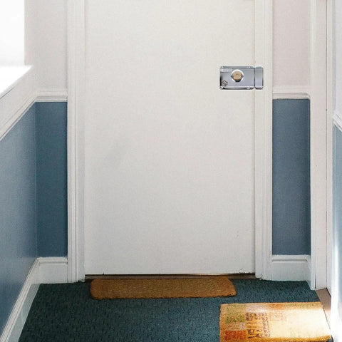 Heavy Duty Stainless Steel Front Door Safety Lock Set Featuring A Beefy Crescent Deadbolt For Foolproof Installation on white door.