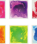 Six Assorted Color 12 by 12 Inch Liquid Floor Tiles Set for Kids, showing pink, purple, red, orange, green, blue liquid tiles.