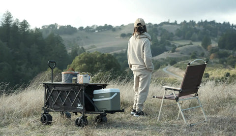 Collapsible Folding Wagon With Built In Table And All Terrain Heavy Duty Utility Cart for camping in hilly countryside