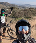 Cyclists wearing polarized sports sunglasses with five interchangeable lenses for guys and gals, ultralight 19.2g on a trail.
