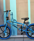 Blue children's bike with 20 inch magnesium alloy one piece wheel set with five spoke rim, disc brake hub and freewheel