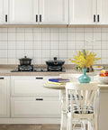 Self Adhesive Cabinet Handles 5.83 Inch Black Zinc Alloy Drawer Pulls installed in a white kitchen.