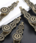 Vintage Cabinet Pulls Set of 5 in Antique Bronze With 3.7 Inch Hole Spacing displayed on black and white surface