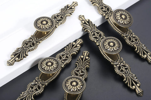 Vintage Cabinet Pulls Set of 5 in Antique Bronze With 3.7 Inch Hole Spacing displayed on black and white surface