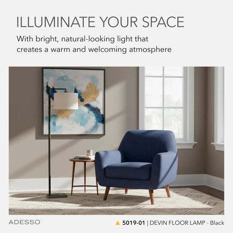 Black Floor Lamp With White Fabric Drum Shade, Three Way Dimmer, 60.75 Inch Tall in modern living room with blue chair.