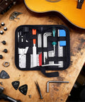 Guitar Setup And Repair Kit 26 Piece Tool Set with Nut Files, String Action Gauge, and Hex Wrenches on wooden table.
