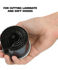 Hand holding Seven In One Hole Saw Kit With One And Three Quarters Inch Depth Includes Seven Diameters From One Inch To Two And A Half Inches