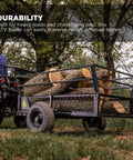Heavy Duty ATV Trailer With 27.5 Cu Ft Bed, 1,400 Lb Load Capacity, transporting logs through grassy terrain