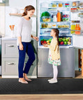 Ergonomic Anti Fatigue Kitchen Floor Mat 4 To 5 Inch Thick Waterproof Non Slip Rug in black, placed in a kitchen setting.