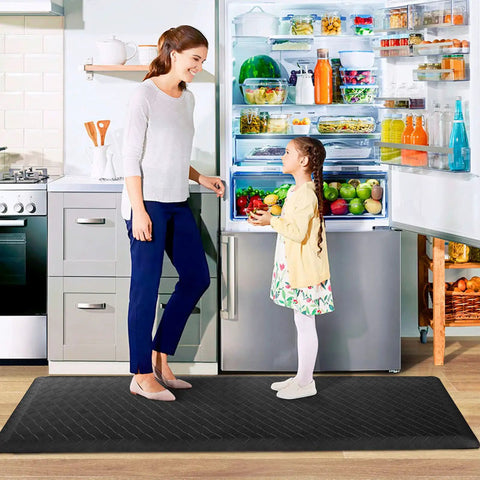 Ergonomic Anti Fatigue Kitchen Floor Mat 4 To 5 Inch Thick Waterproof Non Slip Rug in black, placed in a kitchen setting.