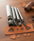 Heart Shape Hollow Punch Set 4 Piece Pro Grade For Leather Craft Tools 4mm 7mm 9mm 19mm Hole Punches displayed on table