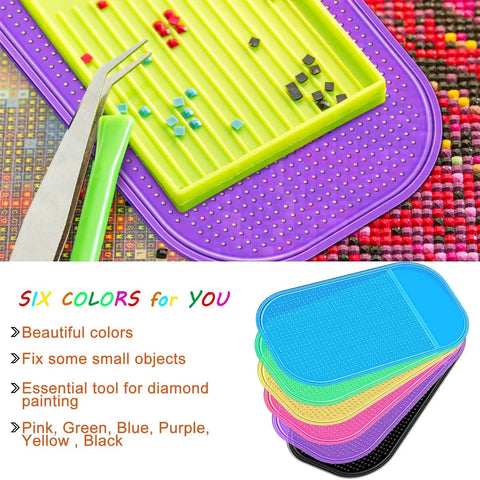 Six Piece Diamond Painting Anti Slip Sticky Mats Set In Six Colors For Keeping Tiny Diamonds In Place While You Craft 5.6 By 3.3 Inch Gel Pad Trays Universal Mount Holder For Adults Art Supplies showing colorful mats and tiny diamonds.