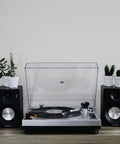 Crosley C100A Silver Belt Drive Turntable With Aluminum Tonearm Pitch Control For 33 And 45 Rpm Vinyl Records on a stylish audio setup.