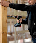 Badass 18 Volt Cordless Brushless Drill Driver Delivering 60 Newton Meters Of Torque And A Featherweight 2 Pound Build operating on wood.