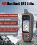 Hiker with F60 Handheld GPS Navigation Device For Hiking With 3 Axis Compass Barometric Altimeter in snowy mountains