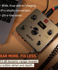 Zenith 2 USB C Audio Interface For Guitar, Vocals, Streaming And Podcasting with knobs and cables on wooden surface