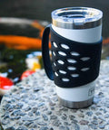 Protective Silicone Tumbler Sleeve With Handle for 20 Oz Stainless Steel Mugs near pond with koi fish