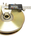 Heavy Duty Six Inch V Groove Gate Roller With Double Ball Bearings showing measurement with caliper for load capacity verification.