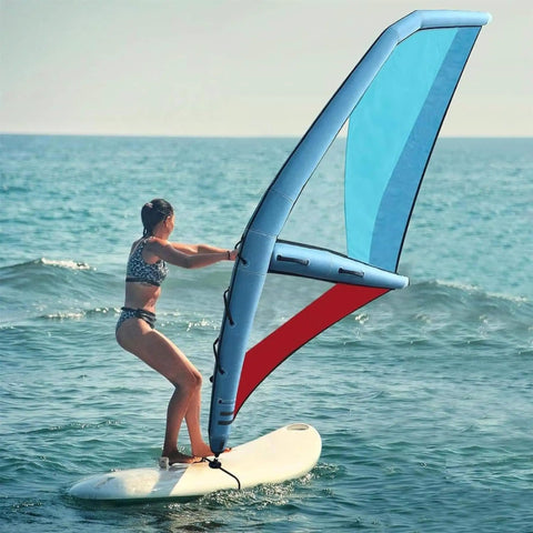 Person using 4.2 Square Meters Inflatable Wing Foil Sail For Wing Foiling, SUP And Kitesurfing on the ocean, clear sky background