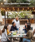 Outdoor gathering under Outdoor Solar String Lights 96 Ft With Remote Control 30 LED Bulbs Dimmable Waterproof Patio Lights