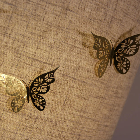 Close-up of Beige Linen Drum Lampshade Set Of 2 For Table Floor And Pendant Lights with butterfly detail on the fabric