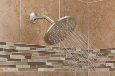 8 Inch Brushed Nickel Rain Showerhead Fixed Round Wide Rain Shower Head With 2.5 GPM Flow Easy Install On 1/2 Inch IPS Arm Single Function Shower For Modern Bathrooms spraying water in tiled bathroom corner