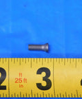 Close-up of a Torx screw on a ruler showing size, part of Straight Up Heavy Duty Replacement Torx Screw Hardware And T A Spade Drill Holder Precision Industrial Machining Tooling Hardcore Workhorse Setup Built Tough For Serious Machine Shops Today.