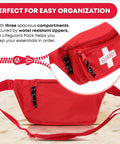 Red first aid fanny pack with whistle and three water-resistant zippered compartments for beach and pool use.