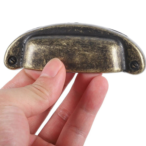 Close-up of Vintage Metal Shell Cabinet Door Handles Set, Antique Bronze Drawer Pulls for Kitchen Cupboard Wardrobe, European Style Hardware.