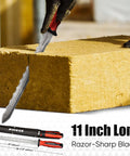 Front view of PINOZE 11-inch insulation knife with dual-serrated stainless blade cutting foam insulation; sheath visible