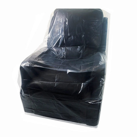 Clear Heavy Duty Chair Covers Set Of 2 Made From 2 Mil Polyethylene covering a chair, protecting from dust and spills.