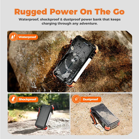 Rugged Beast Power Bank 20000mAh with built-in cables and wireless Apple Watch charger on a rocky outdoor surface.