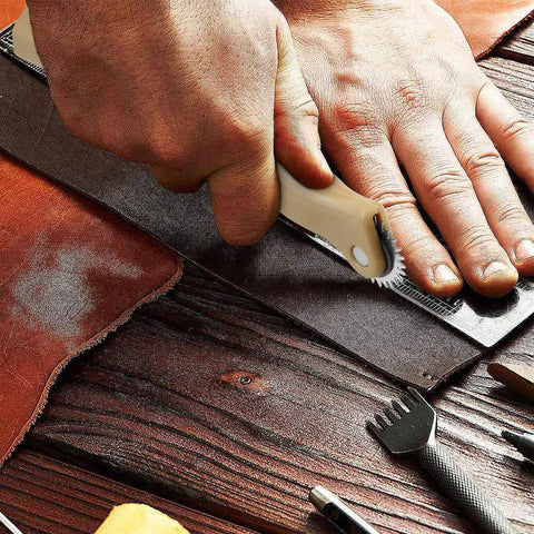 Close-up of hand using a tracing wheel on fabric with Top Shelf 13 Piece French Curve Ruler Set For Sewing Pattern Drafting.