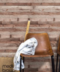 Cinnamon Wood Peel And Stick Wallpaper Self Adhesive Faux Wood Plank behind brown chairs, measuring tape, and shopping bag