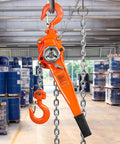 Heavy Duty Manual Lever Hoist 1.5 Ton 3300 Lbs 10 Ft with bright orange finish and dual pawl brake design, in warehouse setting.