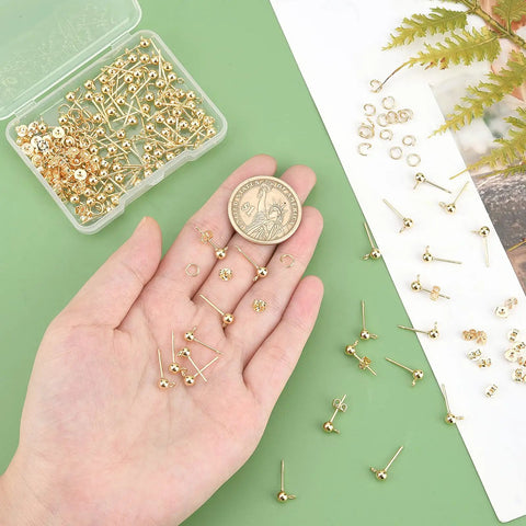 18K Gold Plated Ball Post Earring Studs With Loop Kit For DIY Earrings Making, 300 Pieces Including 100 Loop Posts, 100 Stainless Steel Open Jump Rings, And 100 Ear Nuts For Jewelry Crafting, shown with gold earring parts in a hand