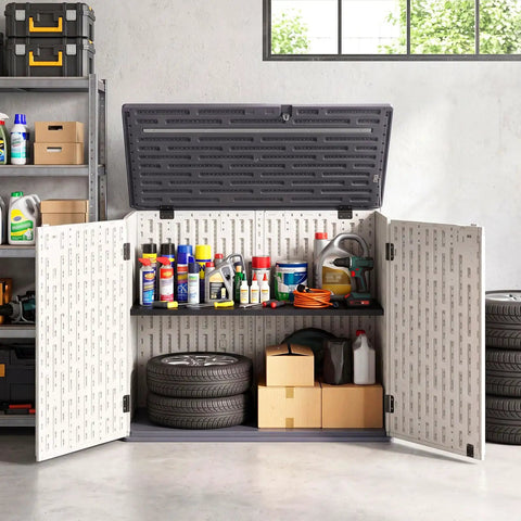 20 Cu Ft Outdoor Storage Cabinet With Adjustable Shelf And Lockable Doors holding tools and supplies in a garage setting.