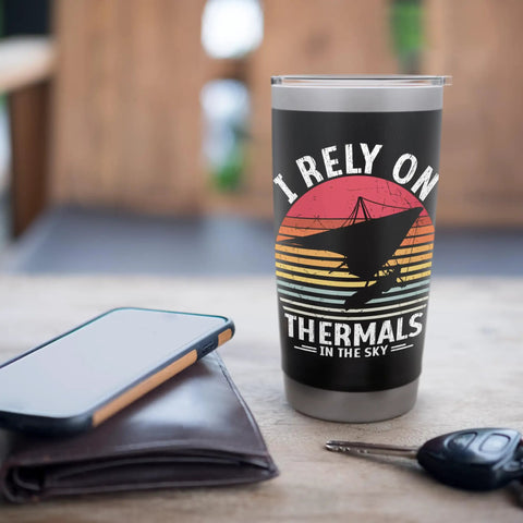 Hang Gliding Themed Stainless Steel Insulated Tumbler For Flying Enthusiasts Coffee Or Tea Cup next to smartphone and wallet
