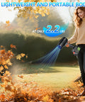 Woman using Cordless Leaf Blower With Dual 4.0Ah Batteries And Charger Lightweight Handheld 21V Electric Blower for lawn cleanup