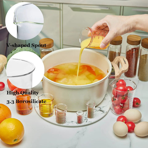 Seven Piece Glass Measuring Cup Set With Borosilicate Beaker Style Nesting Cups, Clear Markings From 1 Tsp To 8 Oz, Your Kitchen Go To For Baking, Cooking And Drink Prep, Durable Glass Easy To Read. 3.3 borosilicate glass cups pouring liquid
