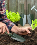 Man using 12 Piece Garden Shovel And Trowel Set With Metal Blades And Plastic Handles Grippy Anti Slip Garden Hand Tools in yard