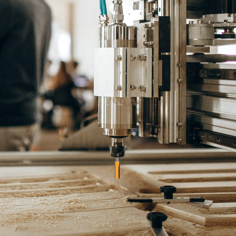 Badass Durability 24 Piece 1/4 Inch Shank Router Bits Set For Swift Precision Woodworking mounted on a CNC machine.