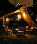 2 Pack Outdoor Solar String Lights 72 Ft With 200 LEDs, IP65 Waterproof illuminating a garden tent setup at night.
