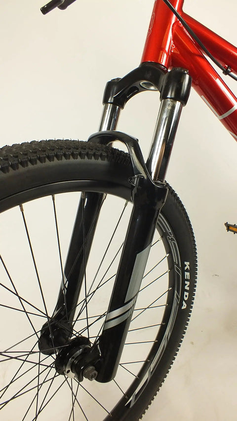 Front view of Salire SJ-50 Dirt Jumper Bike with disc brakes, 26 inch wheels, 100mm suspension fork, and beefy steel frame.