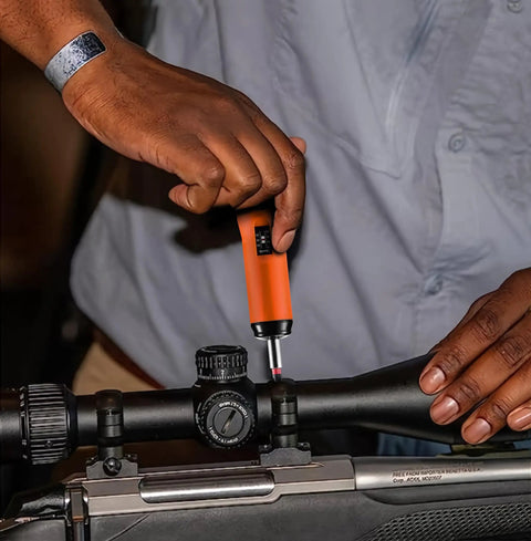 Using Torque Screwdriver And Driver Set For Maintenance And Bike Repair Ten To Seventy Inch Pounds Range T Bar Handle Forty Bits Including Phillips Pozidriv Slotted Hex Torx One Quarter Inch Socket Shaft Extension Orange on scope mount