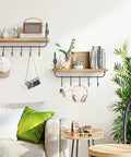 Legit Pine Wood Floating Wall Shelves With Ten Adjustable Mug Hooks For Your Best Coffee Bar Setup Yet showing decorative items and hooks.